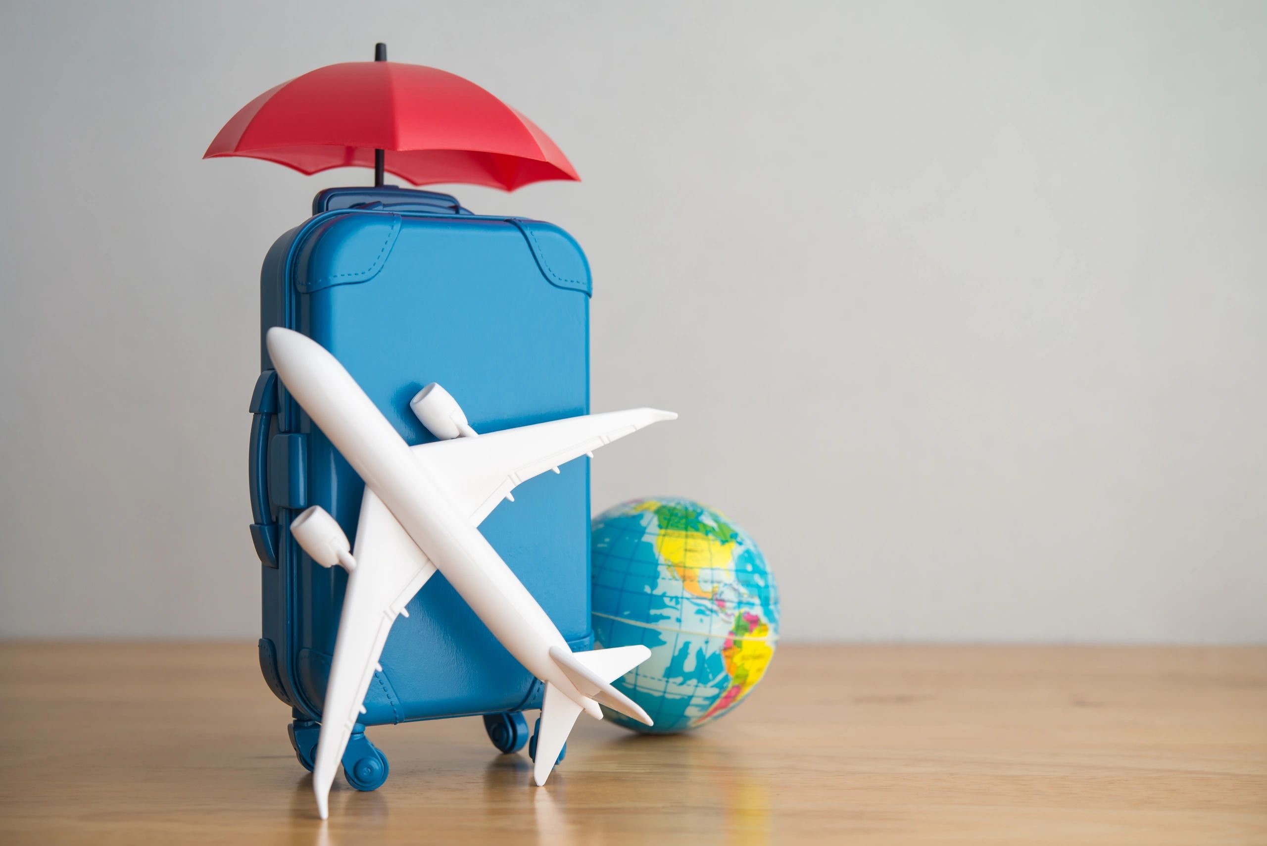 Travel planning items on a table representing trip consultation