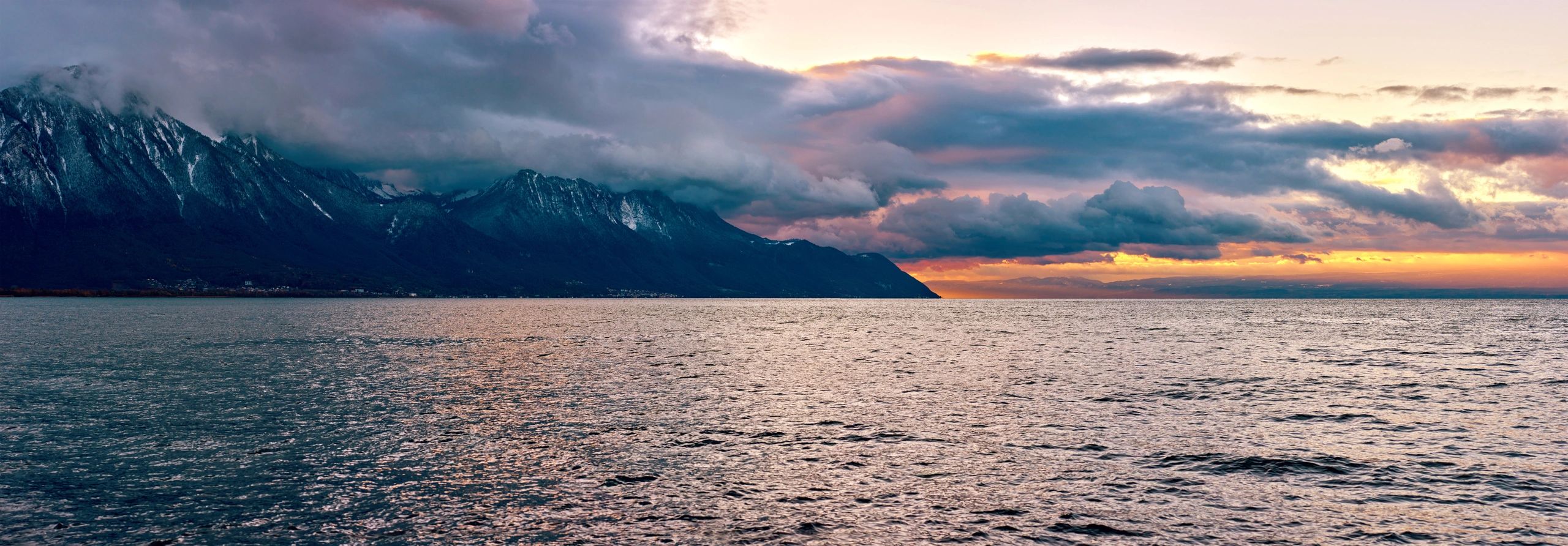 Sunset over Lake Geneva with dramatic sky